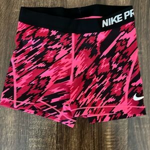 Black and Pink Nike Pros. Size medium.